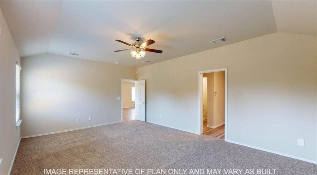 10317 Altair Drive, Waco, TX 76708 Spacious room featuring vaulted ceilings, neutral-toned carpeting, a ceiling fan with light fixture, and window with blinds