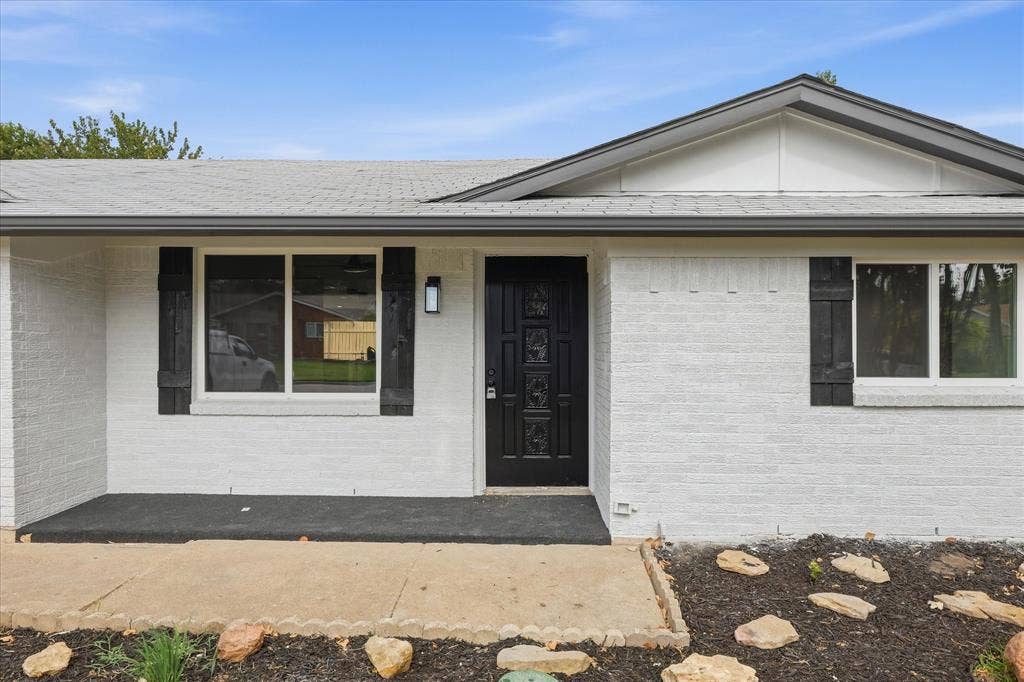 857 Twilight Trail, Grapevine, TX 76051 White painted brick exterior with dark trim and accents