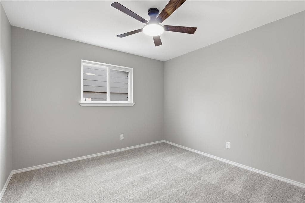 857 Twilight Trail, Grapevine, TX 76051 Carpeted room featuring a ceiling fan with integrated lighting, a single window, and light gray wall paint