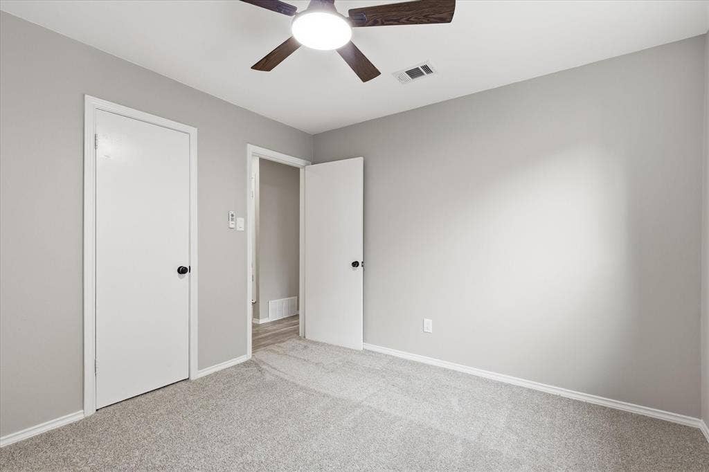 857 Twilight Trail, Grapevine, TX 76051 Room featuring neutral gray walls, light gray carpeting, and white trim