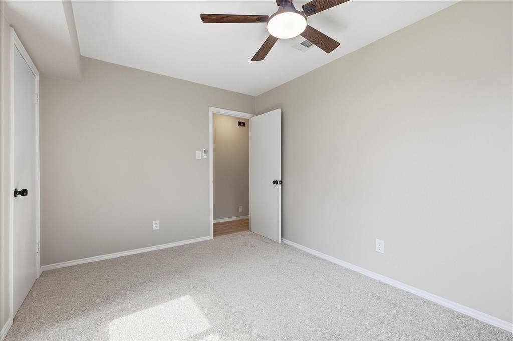 857 Twilight Trail, Grapevine, TX 76051 Neutral-toned room with light beige carpeting and white baseboards