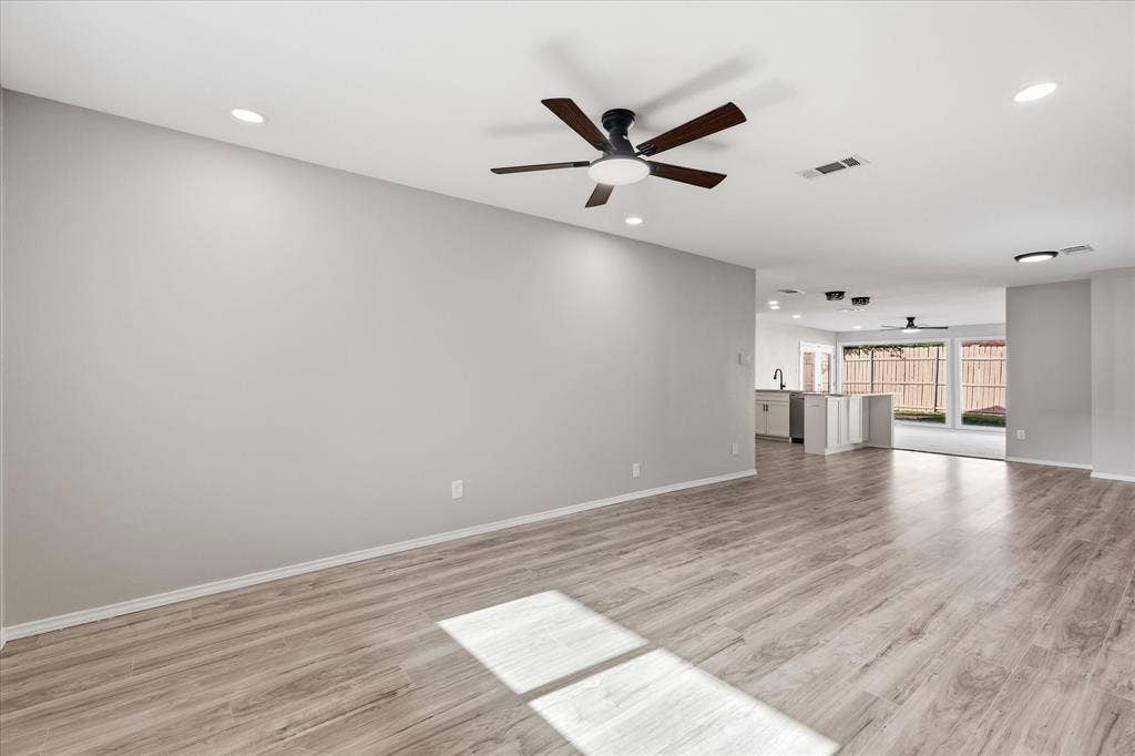 857 Twilight Trail, Grapevine, TX 76051 Spacious interior featuring wood-finish flooring, recessed lighting, and a contemporary ceiling fan