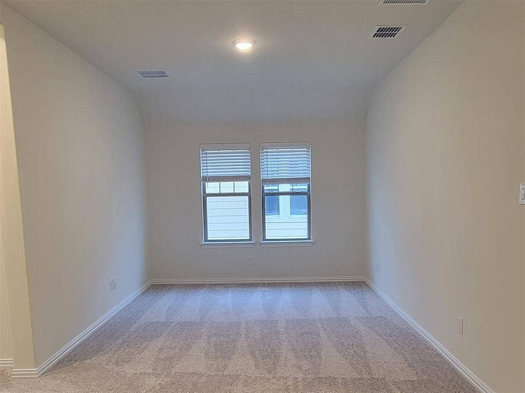 11346 Sugarlands Drive, Frisco, TX 75035 Carpeted room featuring two windows with blinds, recessed lighting, and white baseboards