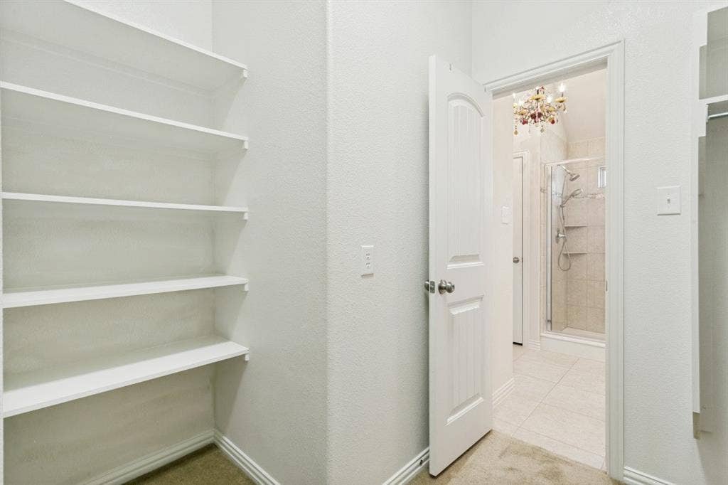 GIGANTIC primary bedroom closet. This is just HALF of it