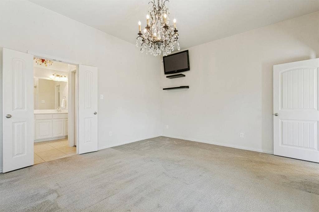 Huge primary bedroom in the rear of the home overlooking the oversized patio