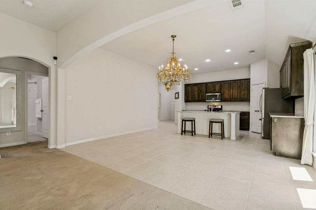 Open-concept living area with a vaulted ceiling