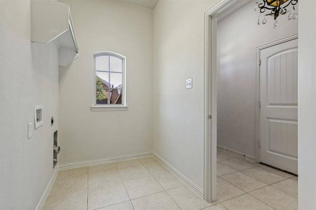 Massive laundry room and more storage behind the photographer