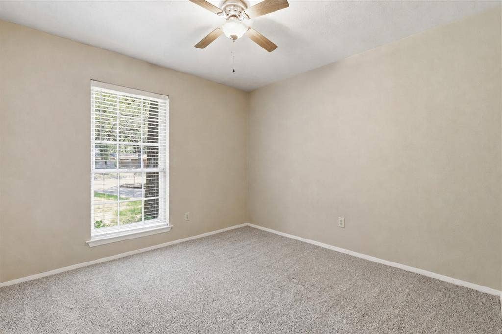 3702 Hastings Drive, Arlington, TX 76013 Bedroom #3 - Additional view of the secondary bedroom featuring new carpet, a ceiling fan, neutral finishes, and a double-door closet