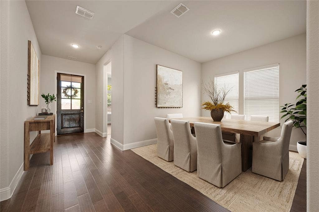 Staged entry and dining room photo