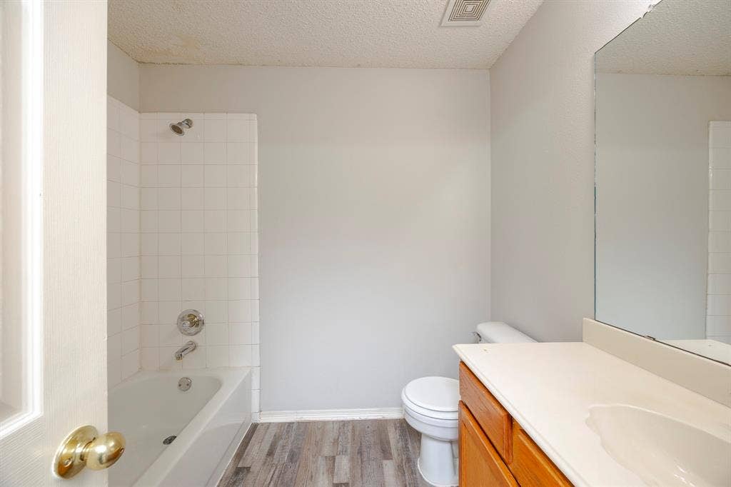 12475 Cajun Drive, Frisco, TX 75035 White subway tile bath/shower combination with chrome fixtures