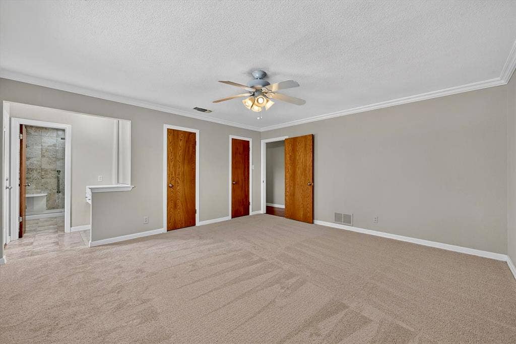 3310 Raintree Drive, Plano, TX 75074 Primary bedroom with two closets and entry to bath and exterior doot to pool