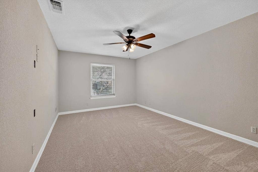 3310 Raintree Drive, Plano, TX 75074 Oversized and flexible fourth bedroom ideal for guests, a home office, or hobby room