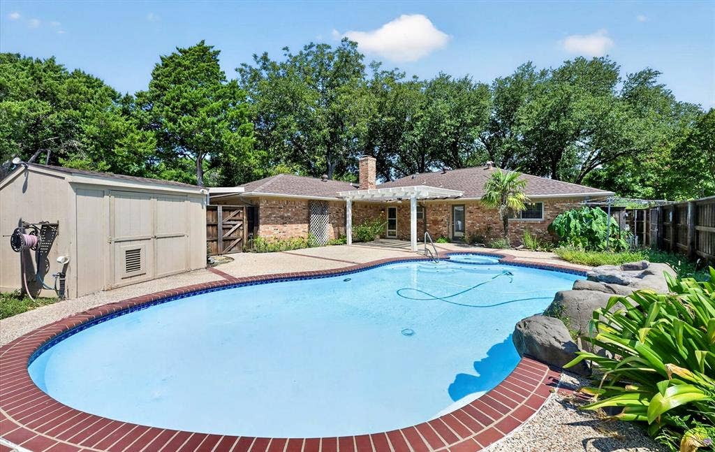 3310 Raintree Drive, Plano, TX 75074 Large crystal-clear 6' deep swimming pool with relaxing spa and tranquil waterfall creates the perfect backyard retreat