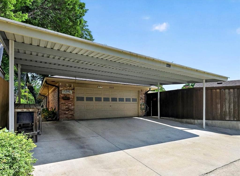 3310 Raintree Drive, Plano, TX 75074 Oversized two-car garage with an attached three-car carport provides exceptional covered parking and storage
