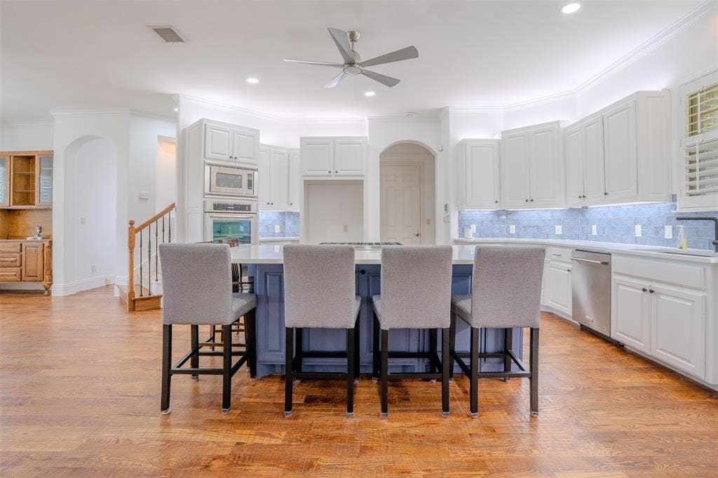710 Corsica Court, Argyle, TX 76226 beautifully remodeled kitchen with stainless appliances and Wolf stovetop