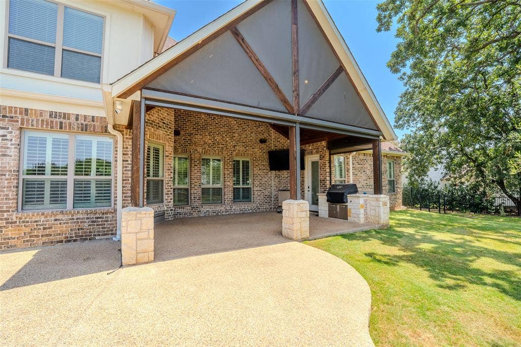710 Corsica Court, Argyle, TX 76226 covered patio with drop down remote controlled screens and Twin Eagles grill