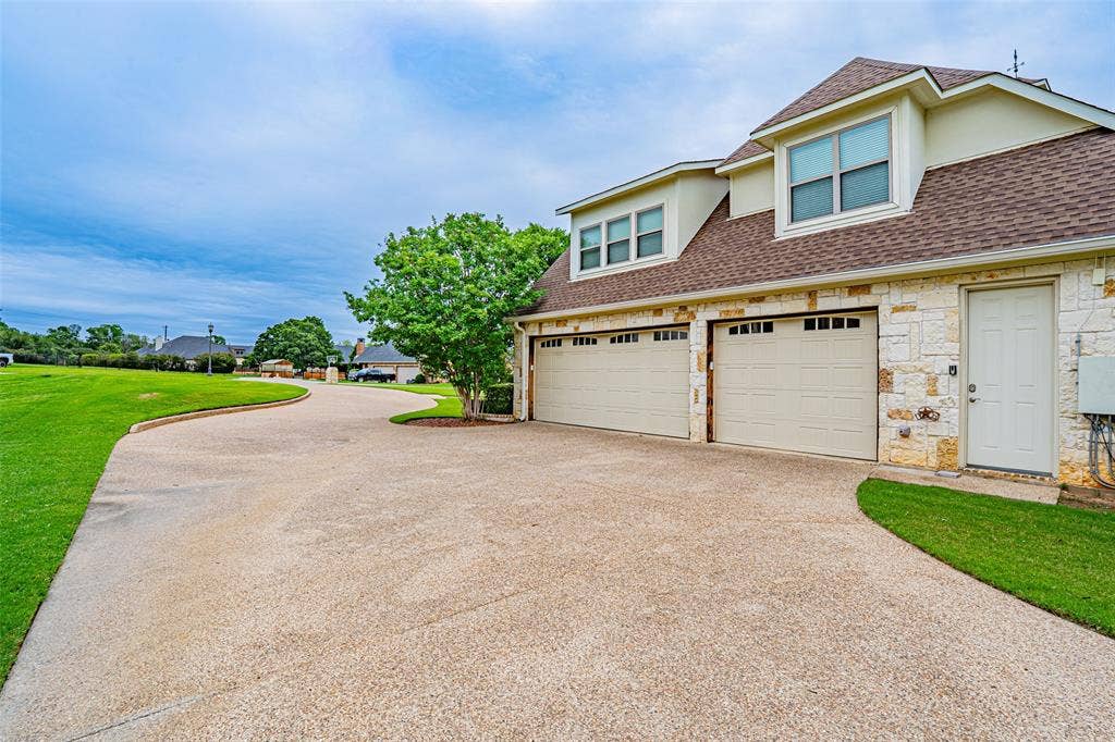 710 Corsica Court, Argyle, TX 76226 3 car garage looking towards the street