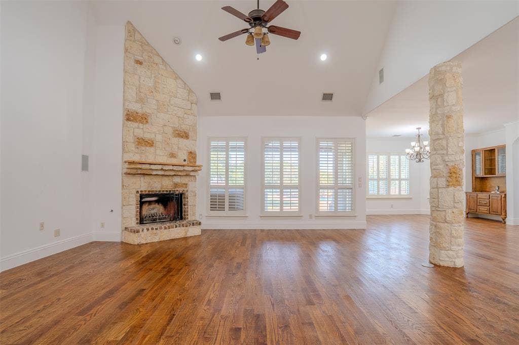 710 Corsica Court, Argyle, TX 76226 Living room with tall ceilings and hand scraped hardwood flooring