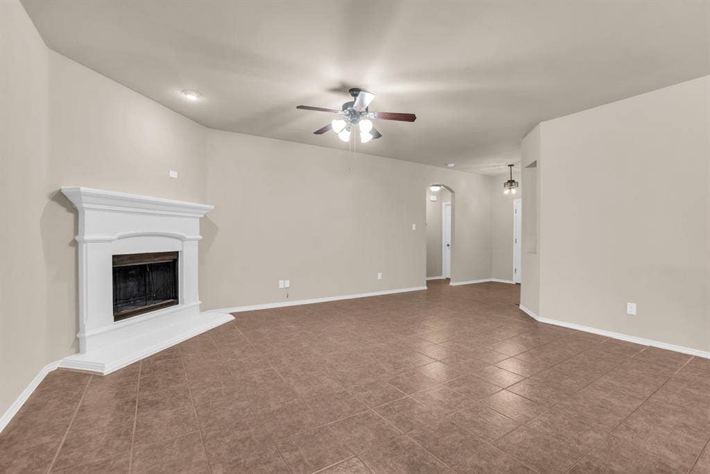 805 Andrews Court, Anna, TX 75409 Living area featuring a white mantel fireplace, tile flooring, a ceiling fan, and recessed lighting