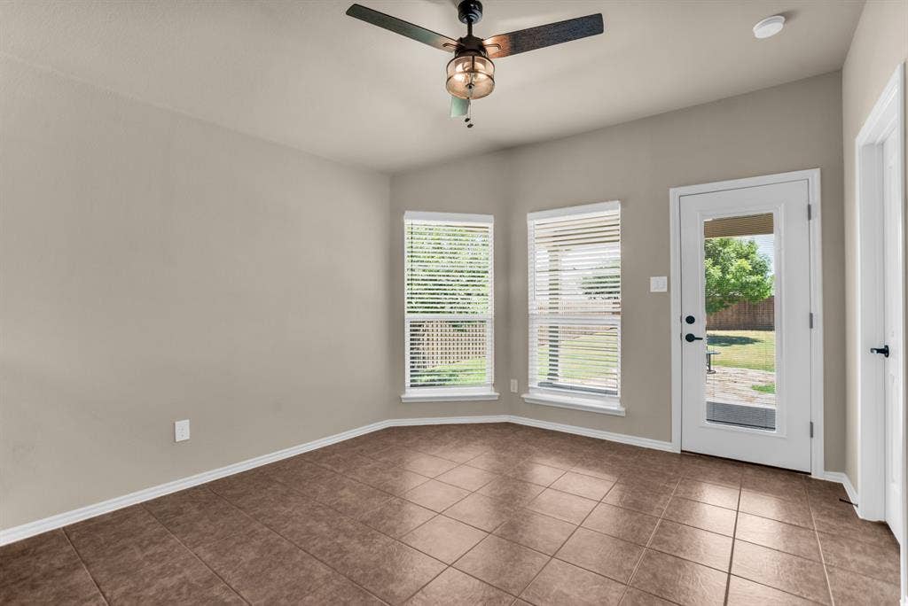 805 Andrews Court, Anna, TX 75409 Breakfast area with covered patio in back.