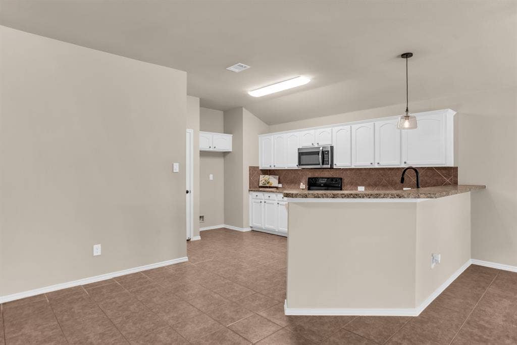 805 Andrews Court, Anna, TX 75409 Open living area with kitchen open to living area. Fresh paint throughout.