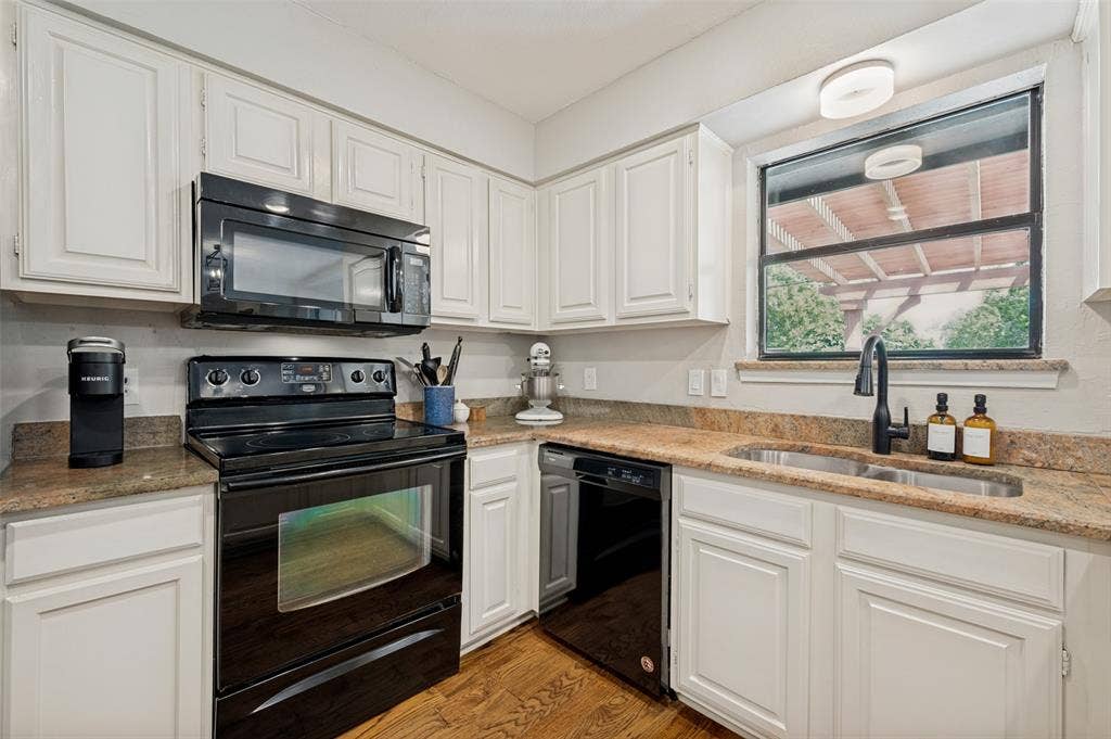8420 Christie Drive, Frisco, TX 75033 Kitchen also includes a double basin stainless steel sink with a matte black faucet, and an ideal nook for a coffee bar