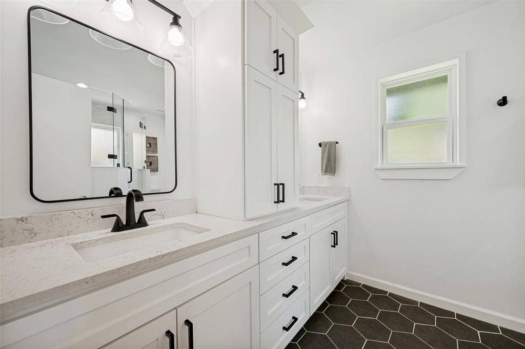 8420 Christie Drive, Frisco, TX 75033 Dual vanity with light-toned countertops and integrated sinks