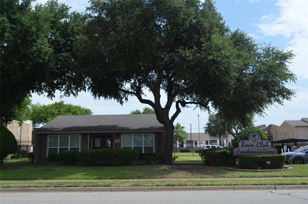 5500 Boca Raton Boulevard, #426, Fort Worth, TX 76112 Low-rise condominium building featuring a dark shingle roof and a central entrance