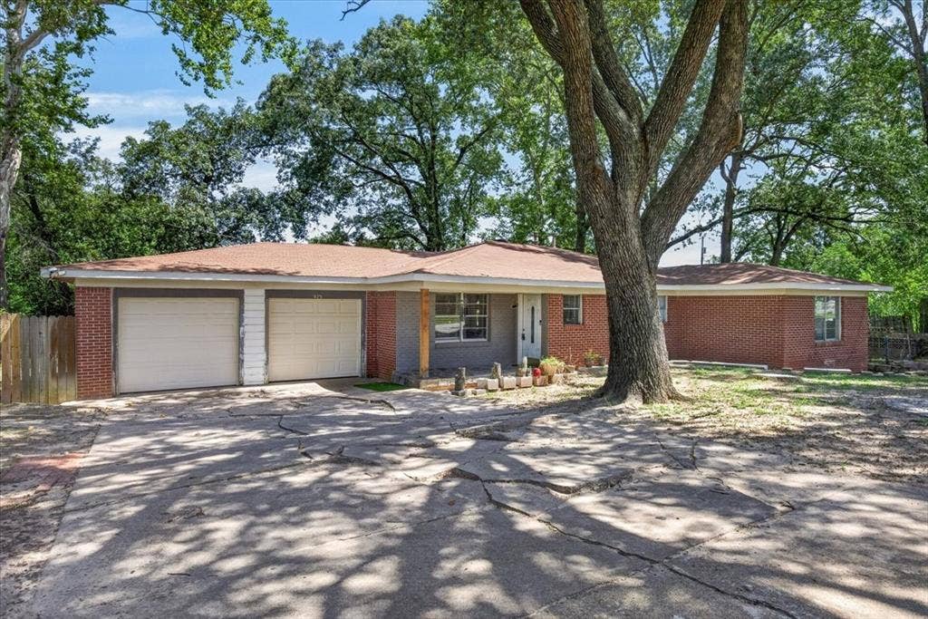 925 Maryland Drive, Athens, TX 75751 Red brick exterior with a two-car garage
