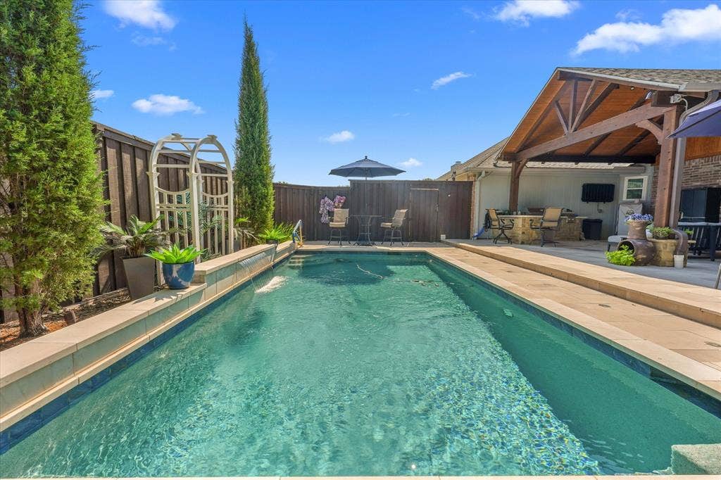 1913 Walters Drive, Plano, TX 75023 Sparkling pool with beautiful water feature