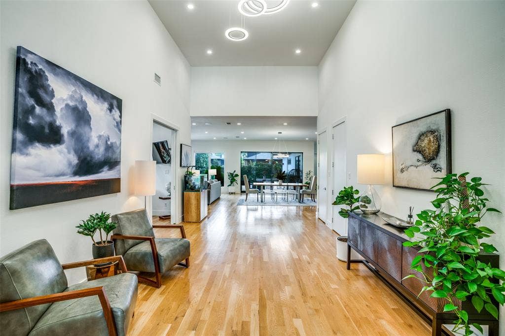 3766 Manana Drive, Dallas, TX 75220 Foyer leads to open living-dining-kitchen with spectcular view of the outdoor area.