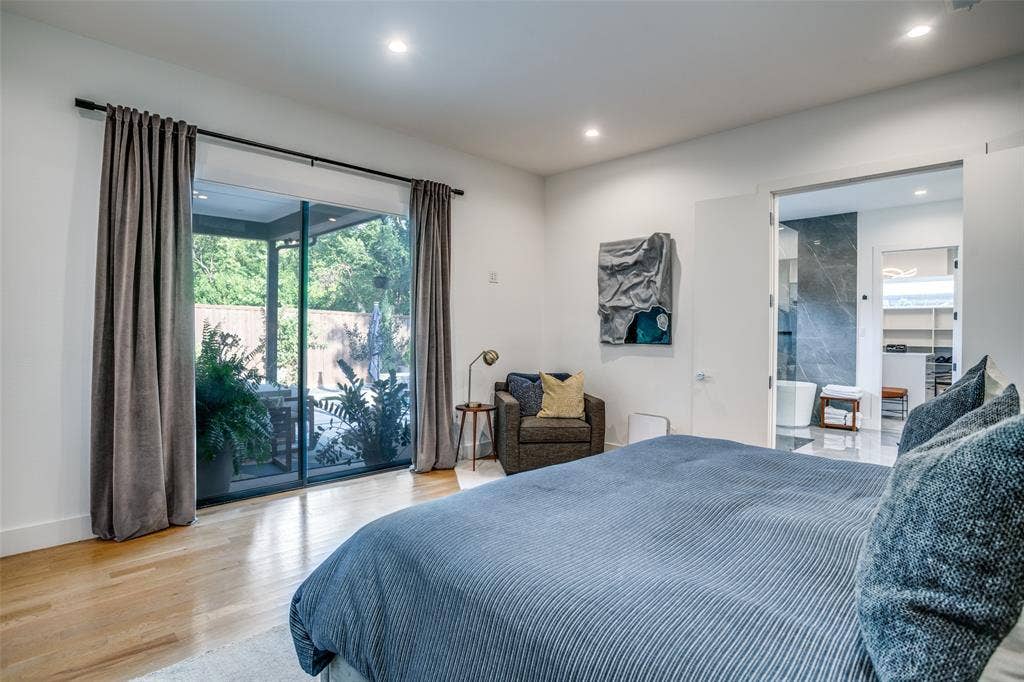 3766 Manana Drive, Dallas, TX 75220 Bedroom has full length sliding doors allowing easy access to outdoor area.