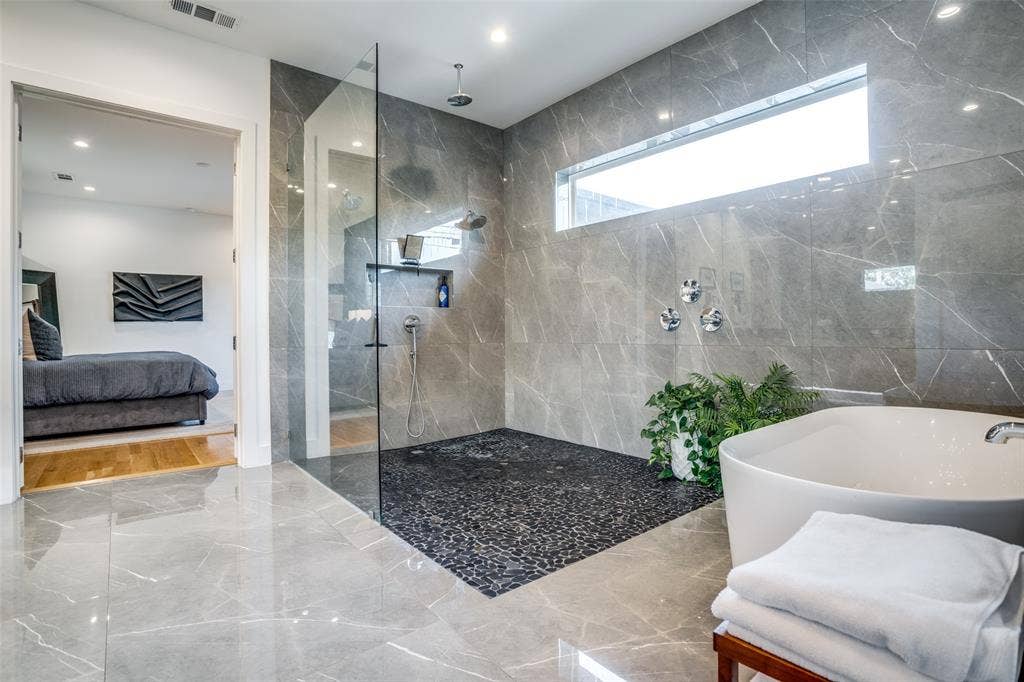 3766 Manana Drive, Dallas, TX 75220 Never run out of hot water in you luxurious shower with the Rheem tankless water heater. Designer Delta Trinisc plumbing fixtures and Kinetic rain can shower heads