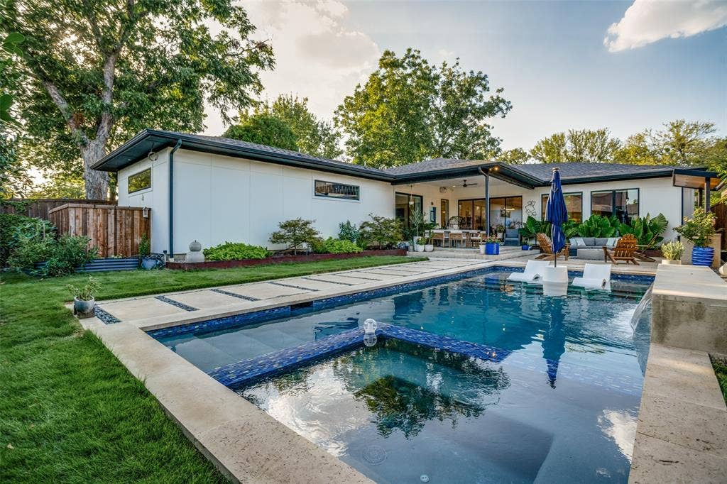 3766 Manana Drive, Dallas, TX 75220 Rear view of house with a pool with connected hot tub, a patio area, a ceiling fan, and an outdoor living space