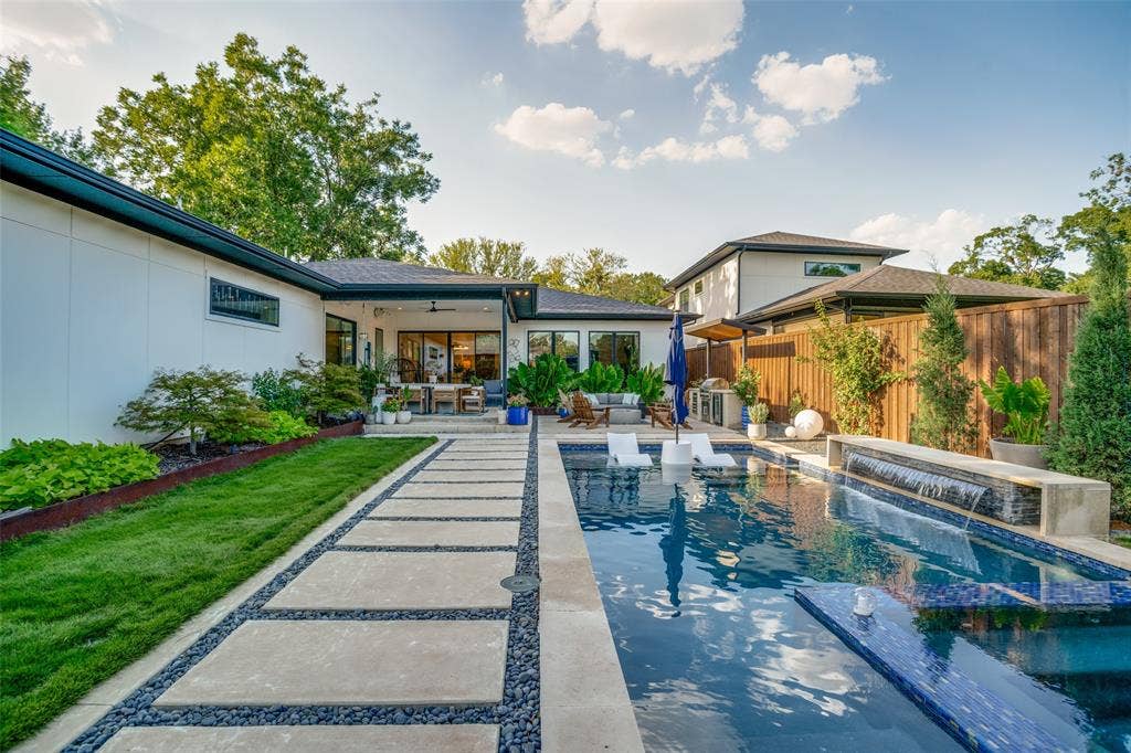 3766 Manana Drive, Dallas, TX 75220 View of swimming pool features patio area, an outdoor living space, and a pool with connected hot tub
