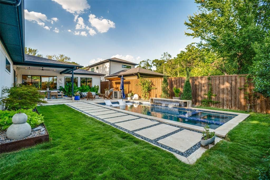 3766 Manana Drive, Dallas, TX 75220 This back yard oasis has everything you need! Multiple sitting areas with in the covered patio and fire pit. Outdoor grilling area with wine fridge. Modern pool/spa with water feature. Landscaped yard with English Ivy and elephant ears that come up every year. Full sprinkler system with rain sensor to keep your yard green all summer.