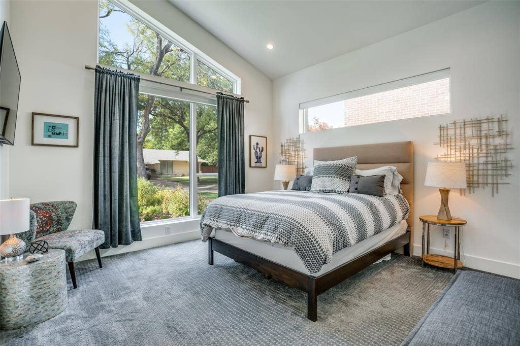 3766 Manana Drive, Dallas, TX 75220 Premium Dream weaver carpeted bedroom featuring vaulted ceiling, large windows and recessed lighting.