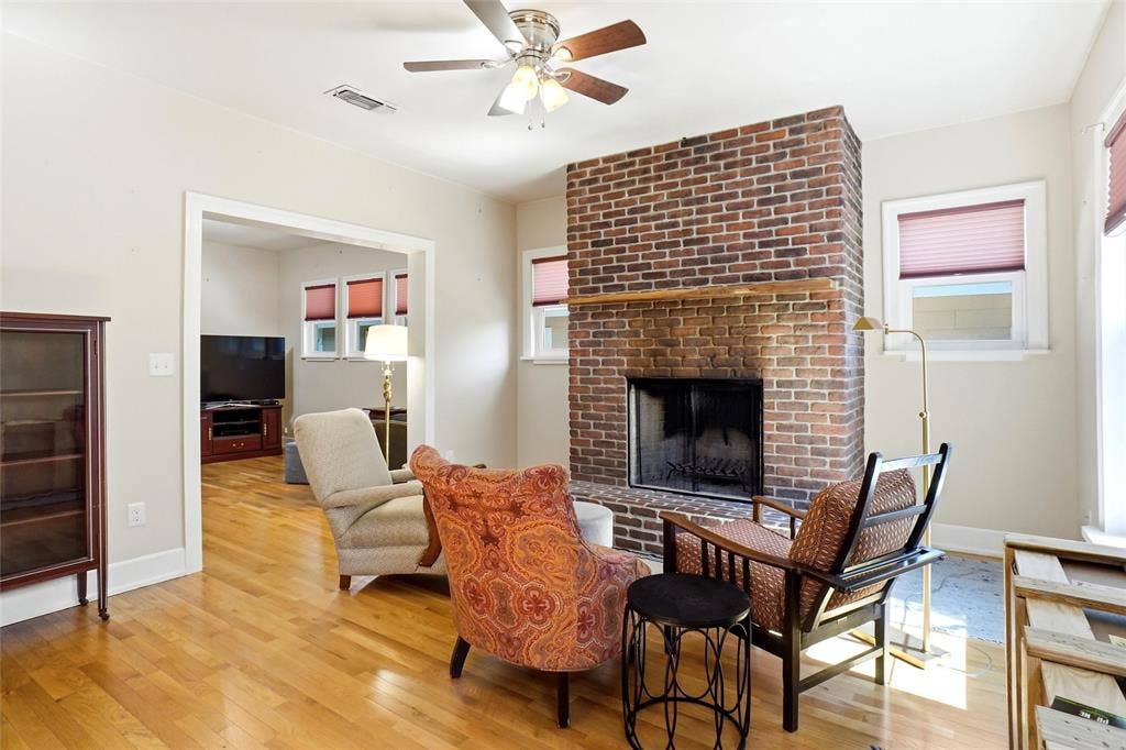 2306 Western Avenue, Fort Worth, TX 76107 Brick fireplace with a wood mantel