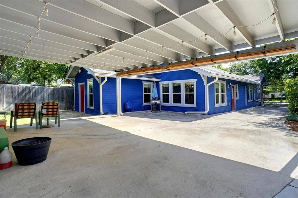 2306 Western Avenue, Fort Worth, TX 76107 Expansive concrete patio with a slatted overhead cover