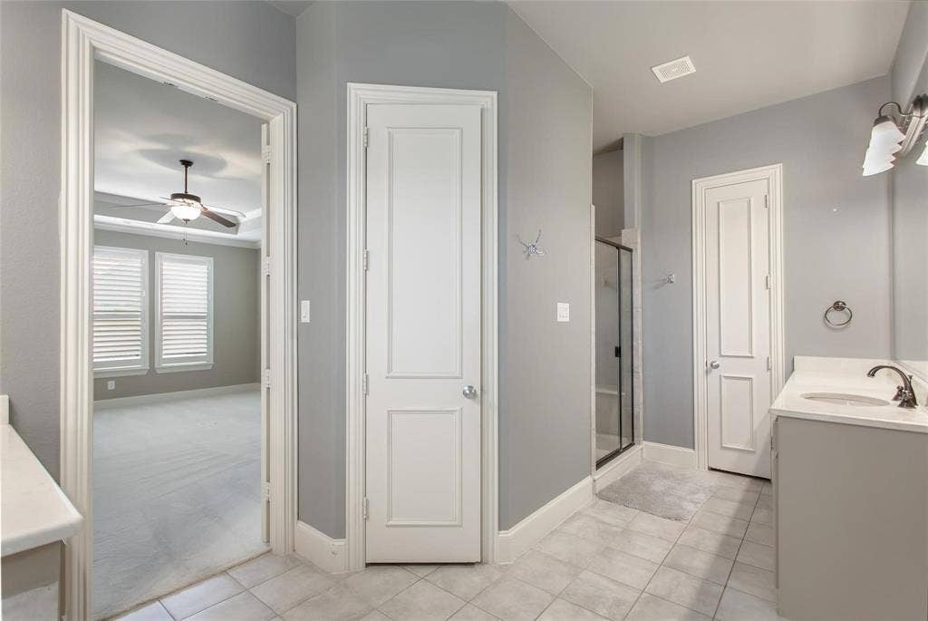 921 Pine Burst Drive, Allen, TX 75013 Bathroom featuring tile flooring, a single vanity with an undermount sink, and a glass-enclosed shower