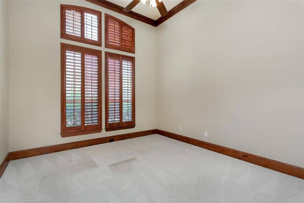 921 Pine Burst Drive, Allen, TX 75013 Tall windows with wood plantation shutters and deep wood trim