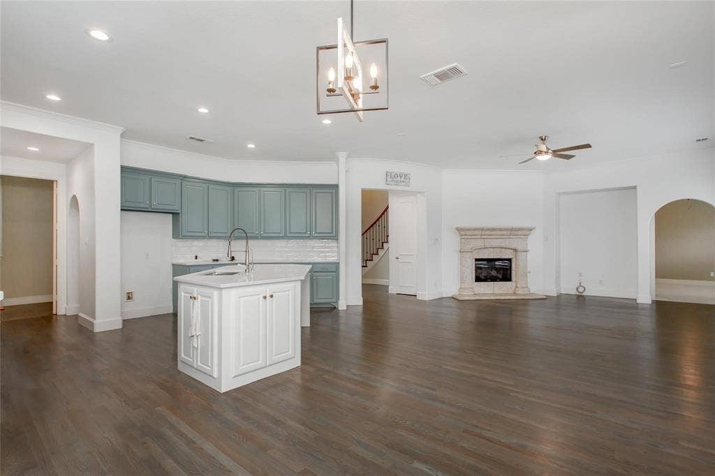 921 Pine Burst Drive, Allen, TX 75013 Open-concept living space with dark wood-finish flooring