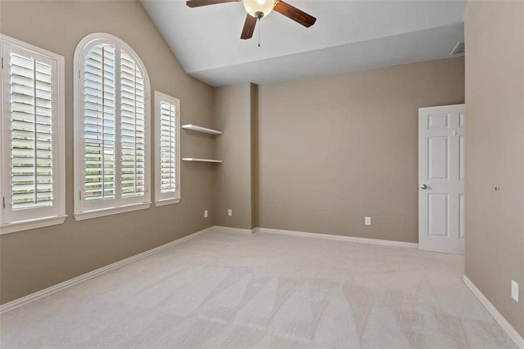 921 Pine Burst Drive, Allen, TX 75013 Interior room featuring an arched window flanked by two rectangular windows, all with white plantation shutters