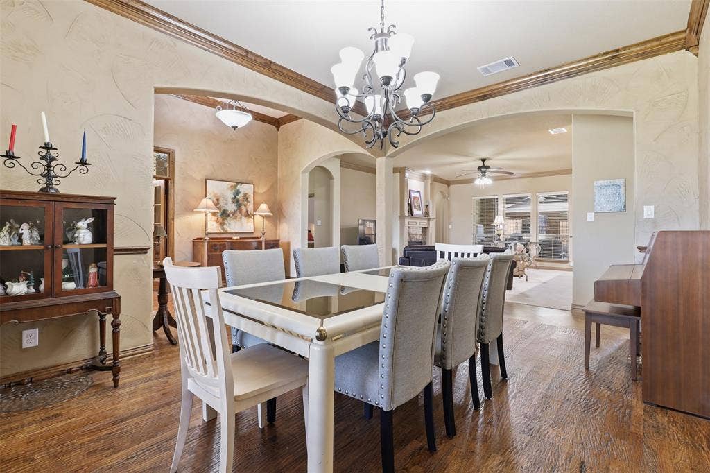Formal dining area featuring hardwood flooring