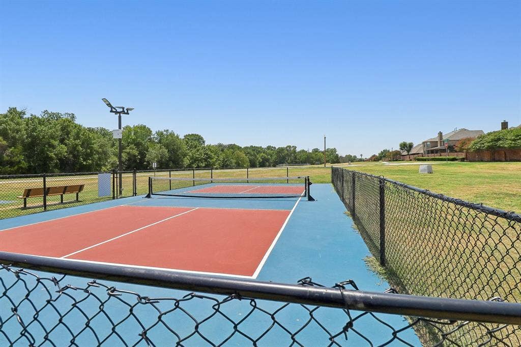 Outdoor court featuring red and blue surfacing