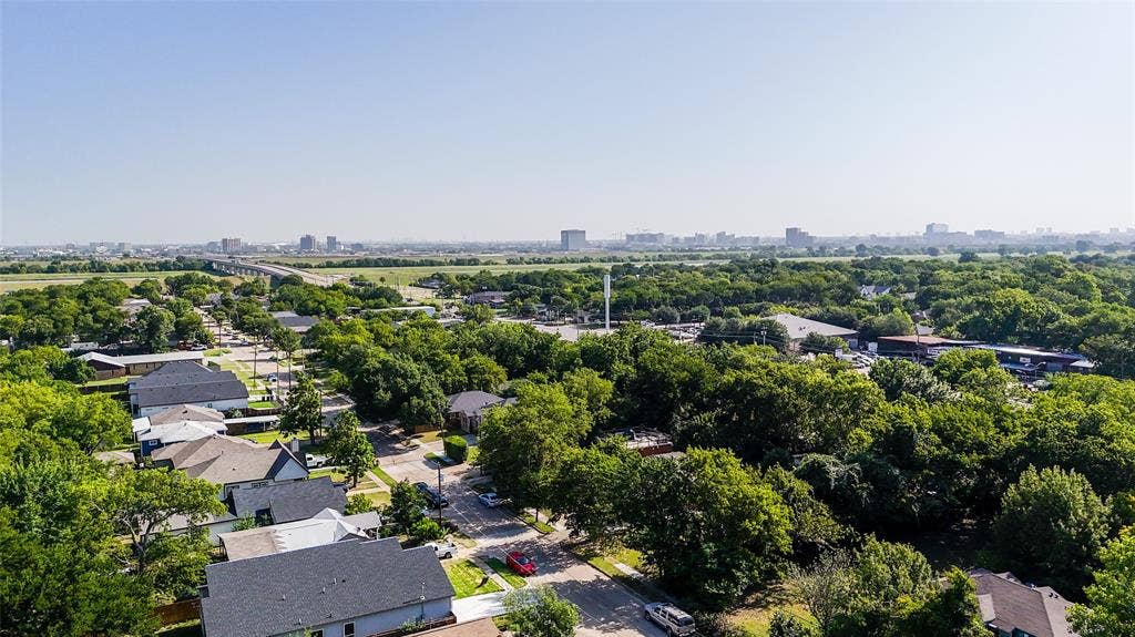 3725 Vineyard Drive, Dallas, TX 75212 Aerial perspective showcasing a residential neighborhood with a dense tree canopy