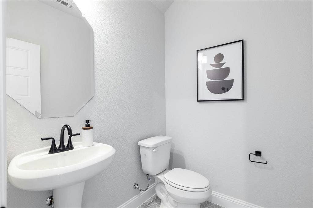 Powder Bath of Kentsdale Farms home in DeSoto, TX by Kindred Homes