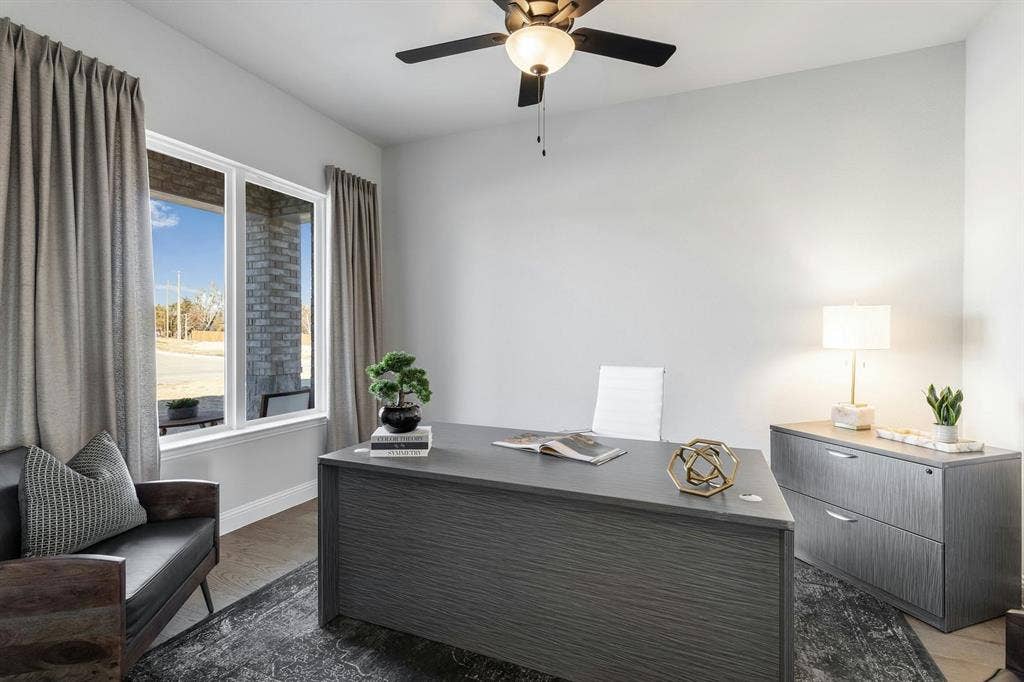 Study in a transitional ranch style home by Kindred Homes