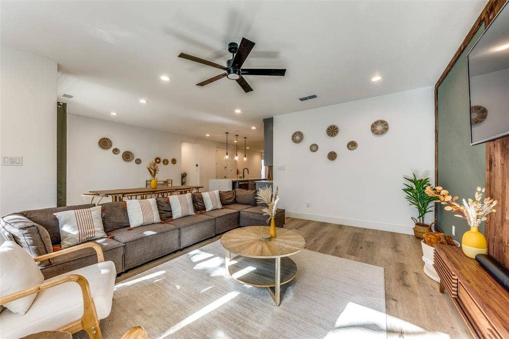 1116 Muncie Avenue, Dallas, TX 75212 Open-concept living area featuring wood-finish flooring, recessed lighting, and a contemporary ceiling fan