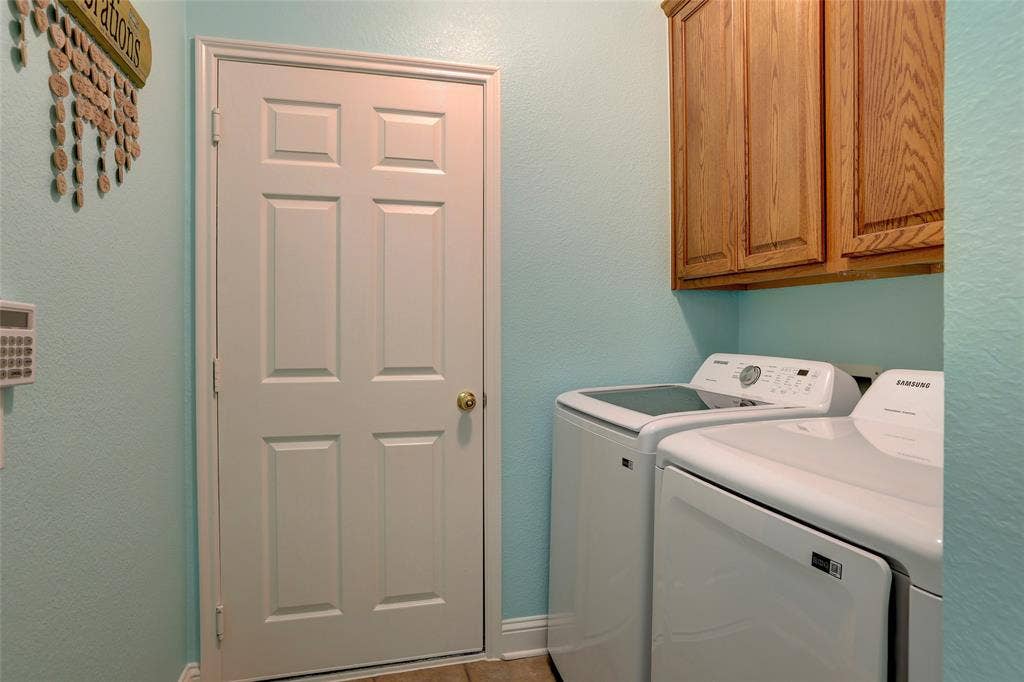 9909 Kaufman Place, Plano, TX 75025 Separate laundry room with utility closet leading to garage